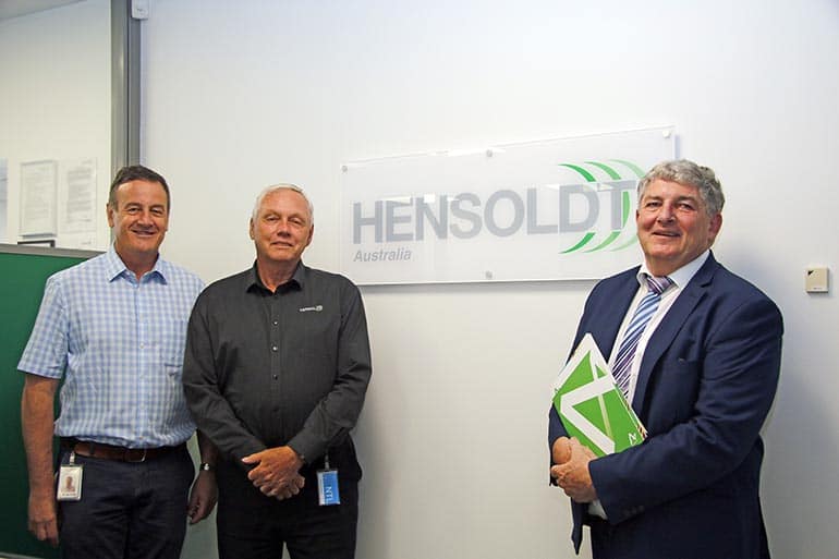 IMAGE: Three men standing at front of HENSOLDT Australia sign